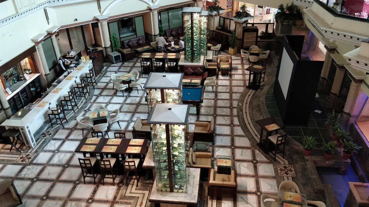 The Suryaa New Delhi Hotel Kültér fotó The lobby of the hotel