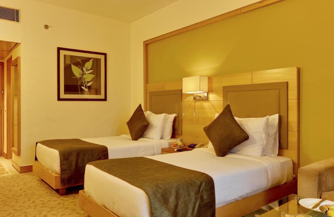 The Suryaa New Delhi Hotel Kültér fotó A room at the hotel